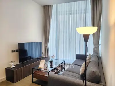 Modern living room with sleek furniture and large window drapes, perfect for urban living.