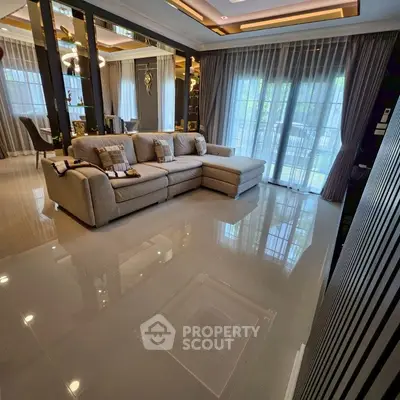 Luxurious modern living room with plush sectional sofa and elegant decor
