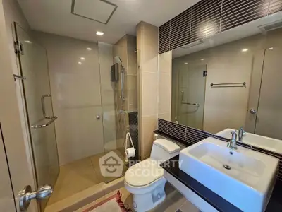 Modern bathroom with glass shower and sleek sink design