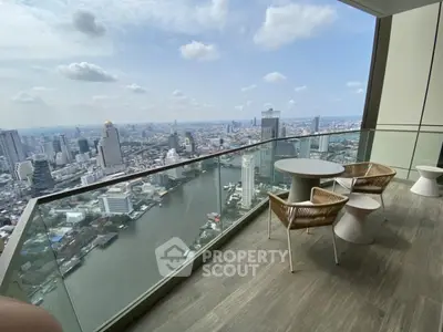 Stunning high-rise balcony with panoramic city and river views, perfect for urban living.