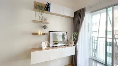 Modern living room with stylish shelving and balcony view