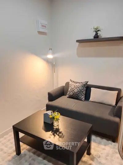 Cozy living room with modern sofa and stylish decor, perfect for relaxation.