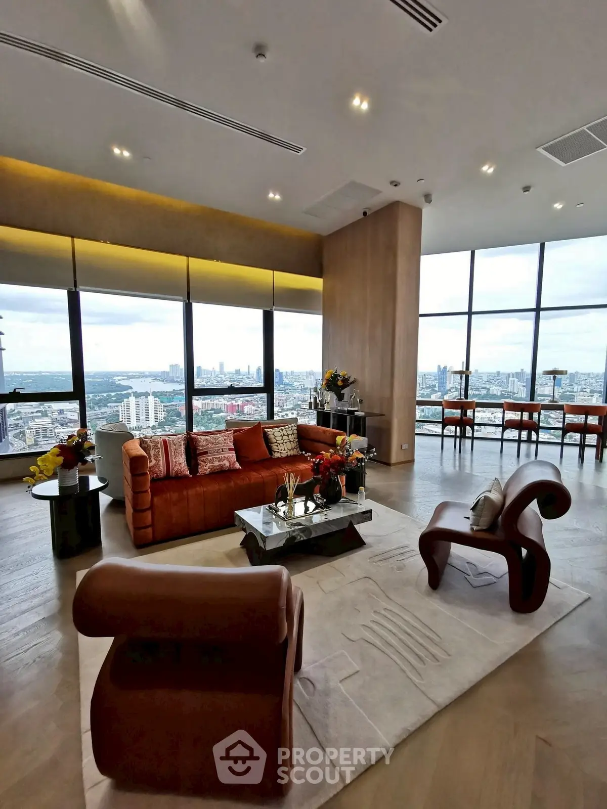 Luxurious living room with panoramic city views and modern furniture