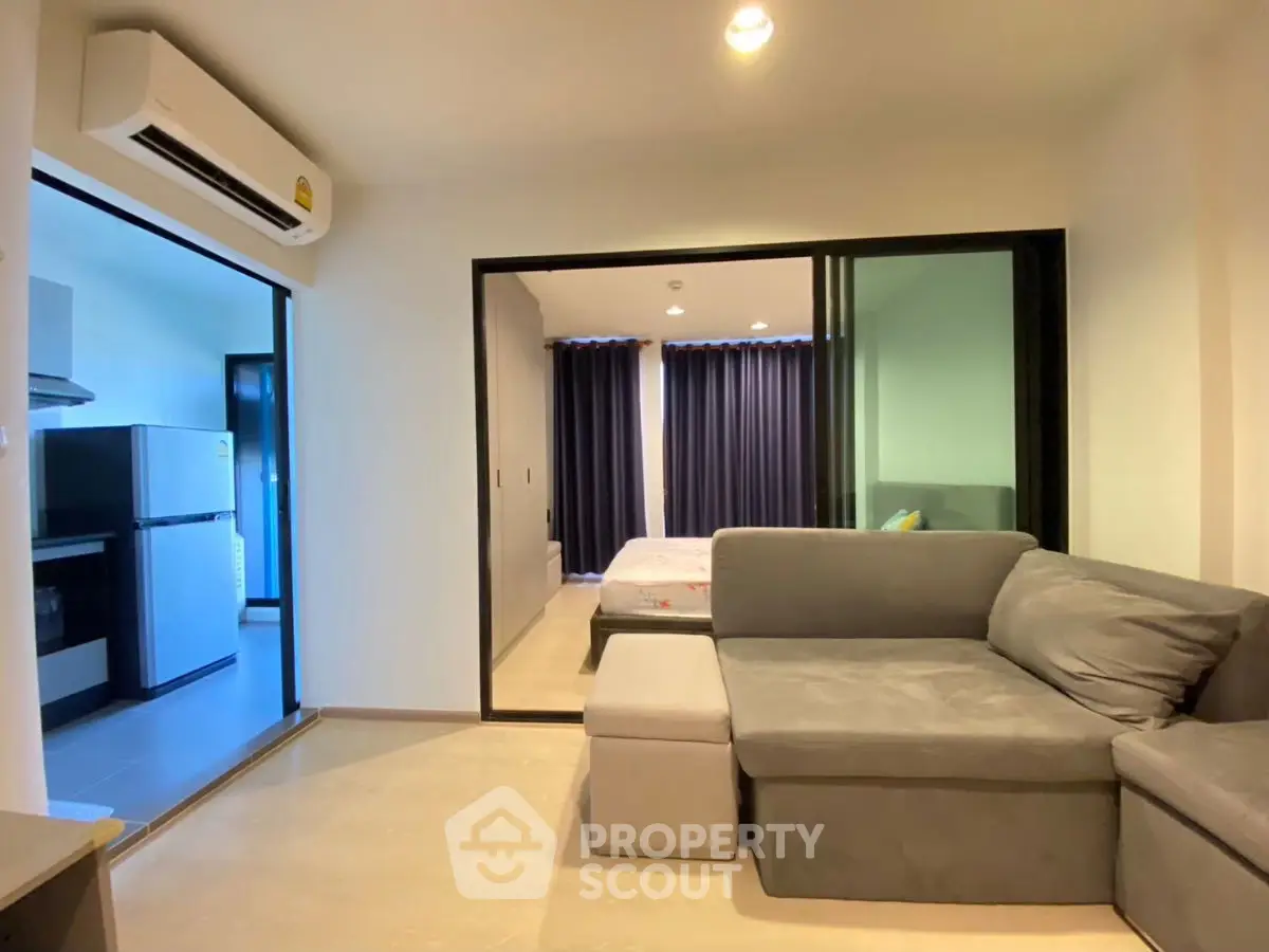 Modern apartment interior with cozy living room and bedroom view