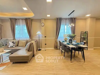Spacious modern living and dining area with elegant decor and ample natural light.