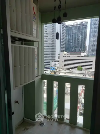 Urban balcony with city skyline view, ideal for modern living in high-rise buildings.