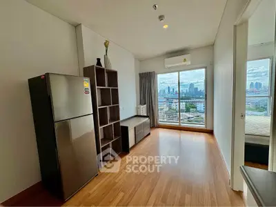 Modern apartment with city view, featuring wooden floors and large windows.