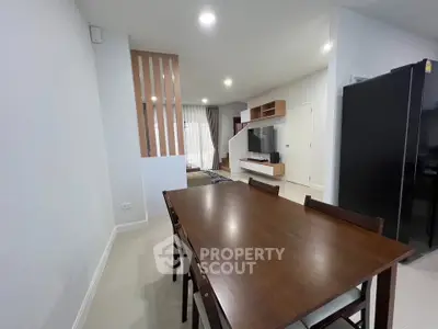 Spacious modern living room with dining area and sleek furniture