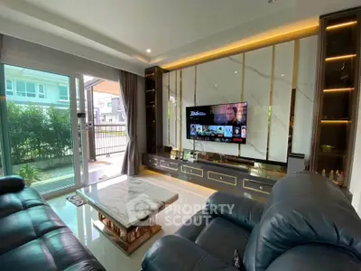 Luxurious living room with modern decor, marble accents, and garden view, perfect for relaxation and entertainment.