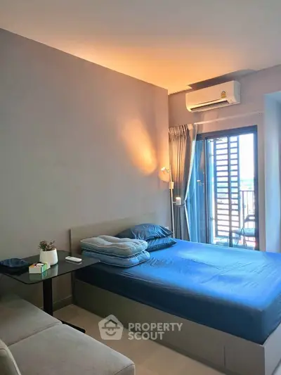 Modern bedroom with balcony access and stylish decor