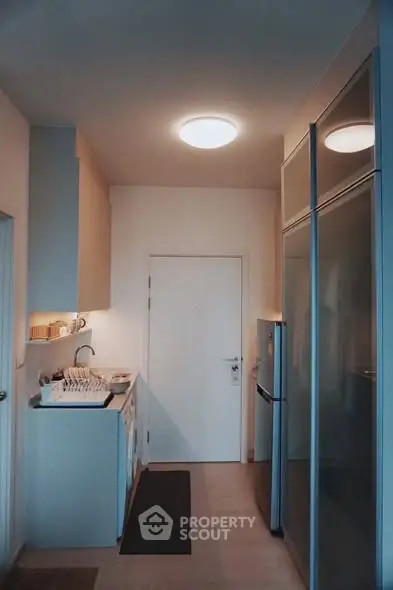 Modern kitchen with sleek appliances and ample storage space.