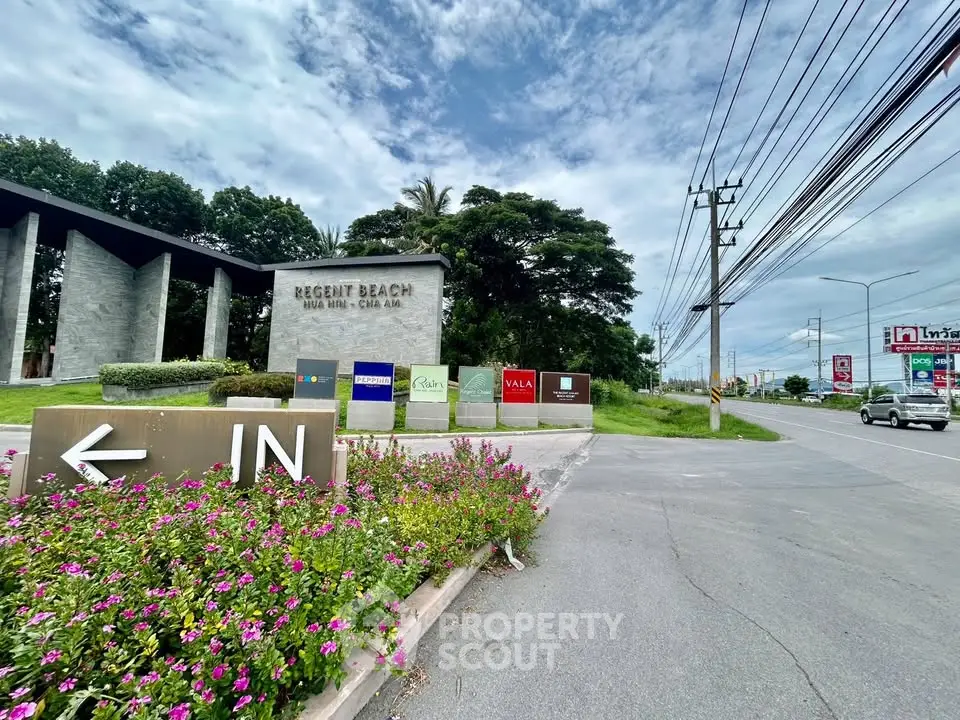 Entrance to Regent Beach Hua Hin with lush greenery and clear signage.