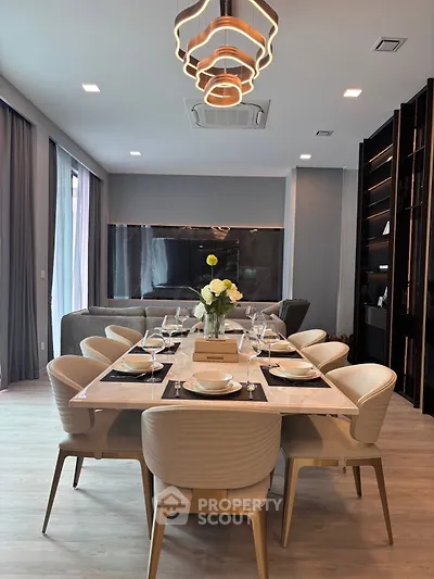 Luxurious modern dining room with elegant table setting and stylish lighting