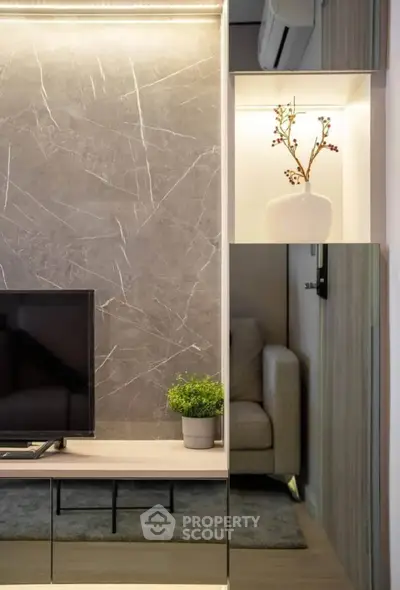 Modern living room with stylish decor and sleek TV setup