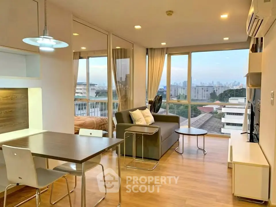 Modern open-plan living room with city view and stylish furniture