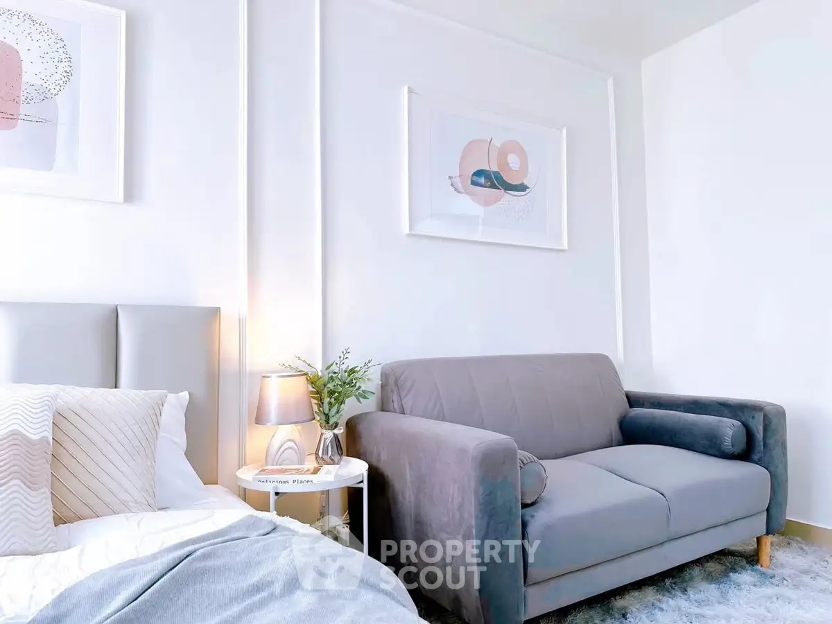 Chic modern bedroom with stylish decor and cozy seating area