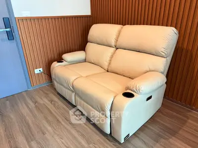 Luxurious beige leather sofa in modern living room with wood paneling and sleek flooring.