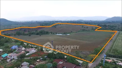 Expansive aerial view of prime real estate land with clear boundary markings, ideal for development.