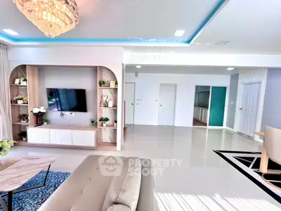 Spacious modern living room with elegant decor and built-in TV unit