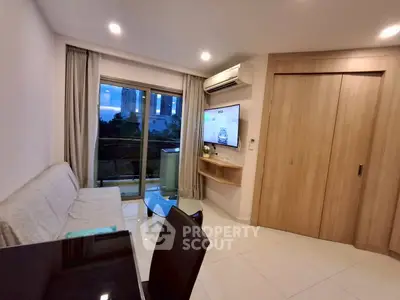Modern living room with balcony view and sleek furnishings