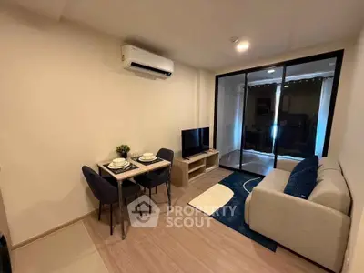 Modern living room with cozy sofa, dining area, and TV, featuring sleek design and warm lighting.