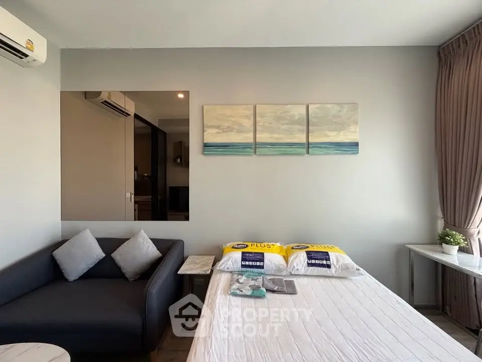 Modern living room with sofa and wall art in a stylish apartment