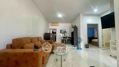 Spacious living room with modern furniture and open layout in a stylish apartment.