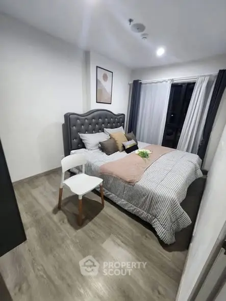 Cozy modern bedroom with stylish decor and natural light