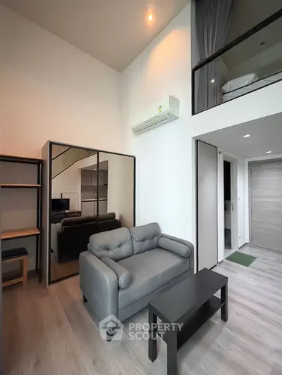 Modern loft apartment with stylish living room and mezzanine bedroom