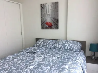 Cozy bedroom with stylish decor and comfortable bedding in modern apartment.
