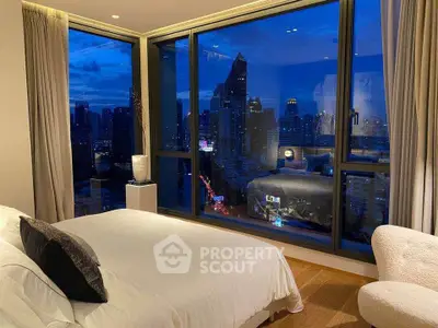 Luxurious bedroom with stunning city skyline view at dusk, featuring floor-to-ceiling windows and elegant decor.