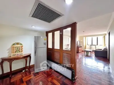 Spacious living area with wooden flooring and modern decor