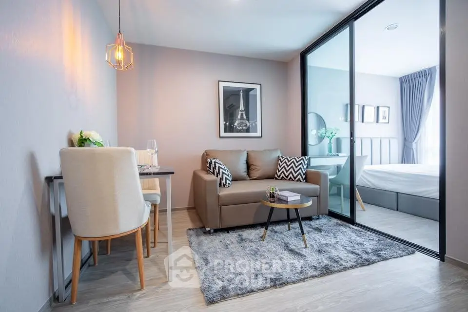 Modern living room with cozy seating and stylish decor in a contemporary apartment.