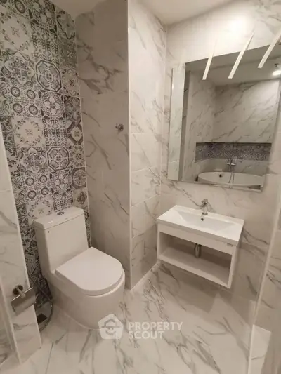 Modern bathroom with elegant marble tiles and stylish fixtures