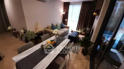 Stylish living room with elegant dining area and cozy seating, perfect for modern living.