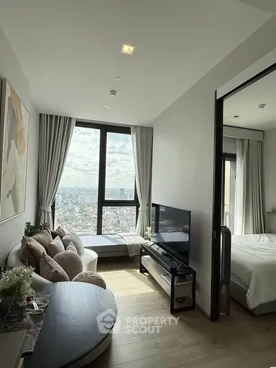 Modern living room with stunning city view and cozy seating area