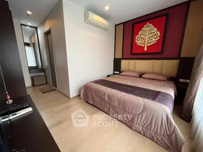 Modern bedroom with elegant decor and air conditioning in a stylish apartment.
