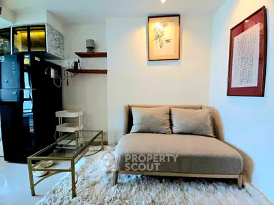 Cozy living room with modern decor and plush rug