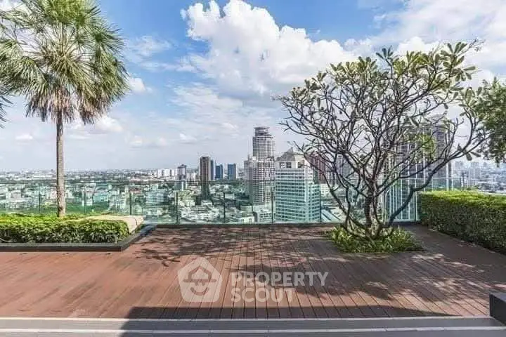 Stunning rooftop view of city skyline with lush greenery and wooden deck.