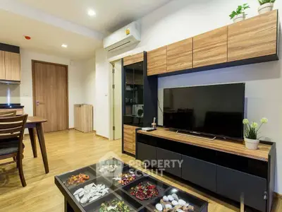 Modern living room with stylish wooden furniture and sleek TV setup