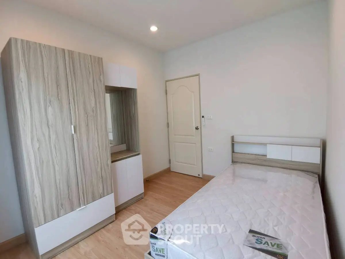 Cozy bedroom with modern wooden furniture and natural light