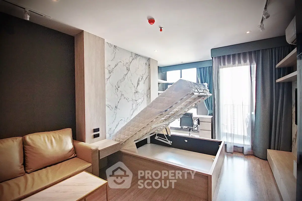 Modern studio apartment with multifunctional furniture and balcony view