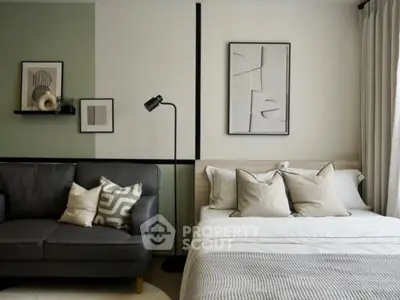 Modern bedroom with stylish decor and cozy seating area, perfect for relaxation and comfort.
