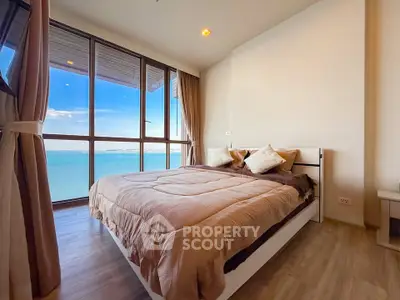 Luxurious bedroom with stunning ocean view and modern decor