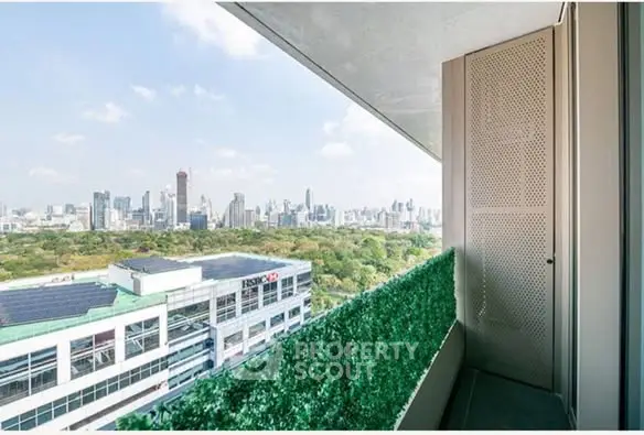 Stunning cityscape view from a modern balcony with lush greenery.