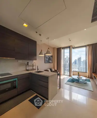 Modern open-layout kitchen and living room with city skyline view
