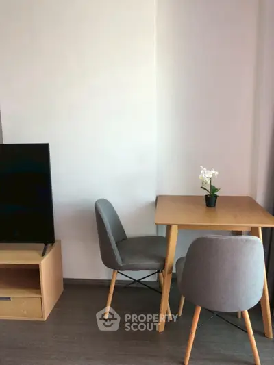 Cozy modern living room with stylish furniture and natural light, perfect for relaxation and entertainment.