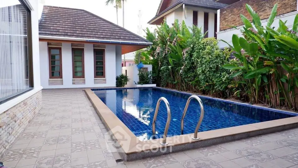 Luxurious villa with private pool and lush garden in tropical setting