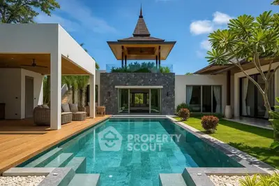 Luxurious villa with stunning pool and tropical garden, perfect for relaxation and entertainment.