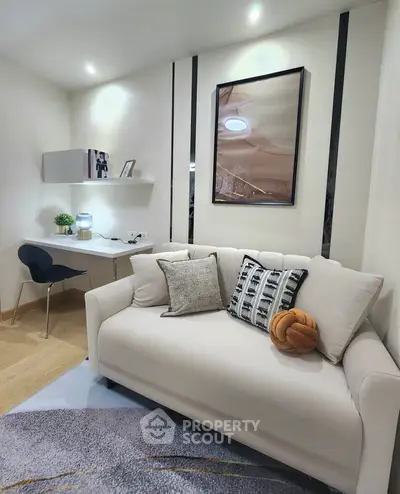 Modern living room with cozy sofa and stylish decor in a contemporary apartment.